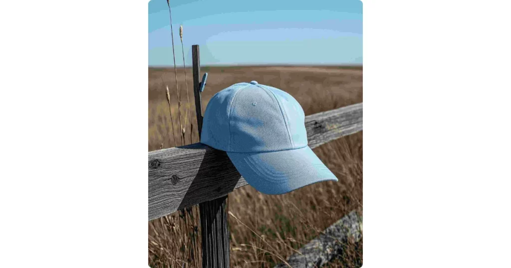 a cap on a wooden fence